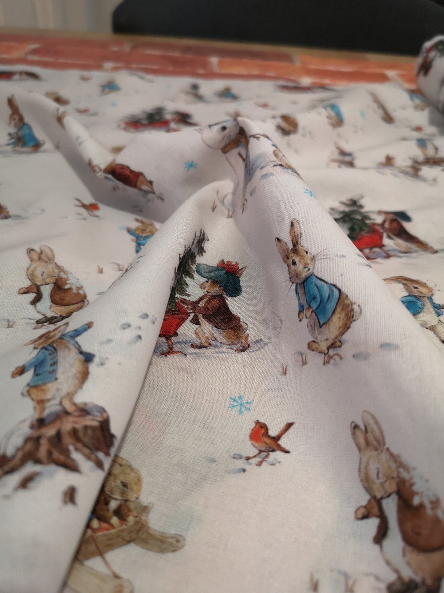 Licensed Peter Rabbit Christmas cotton: rabbits, Christmas pudding, snowman, sledge, stockings, Robins, presents, wreath, snow, tree