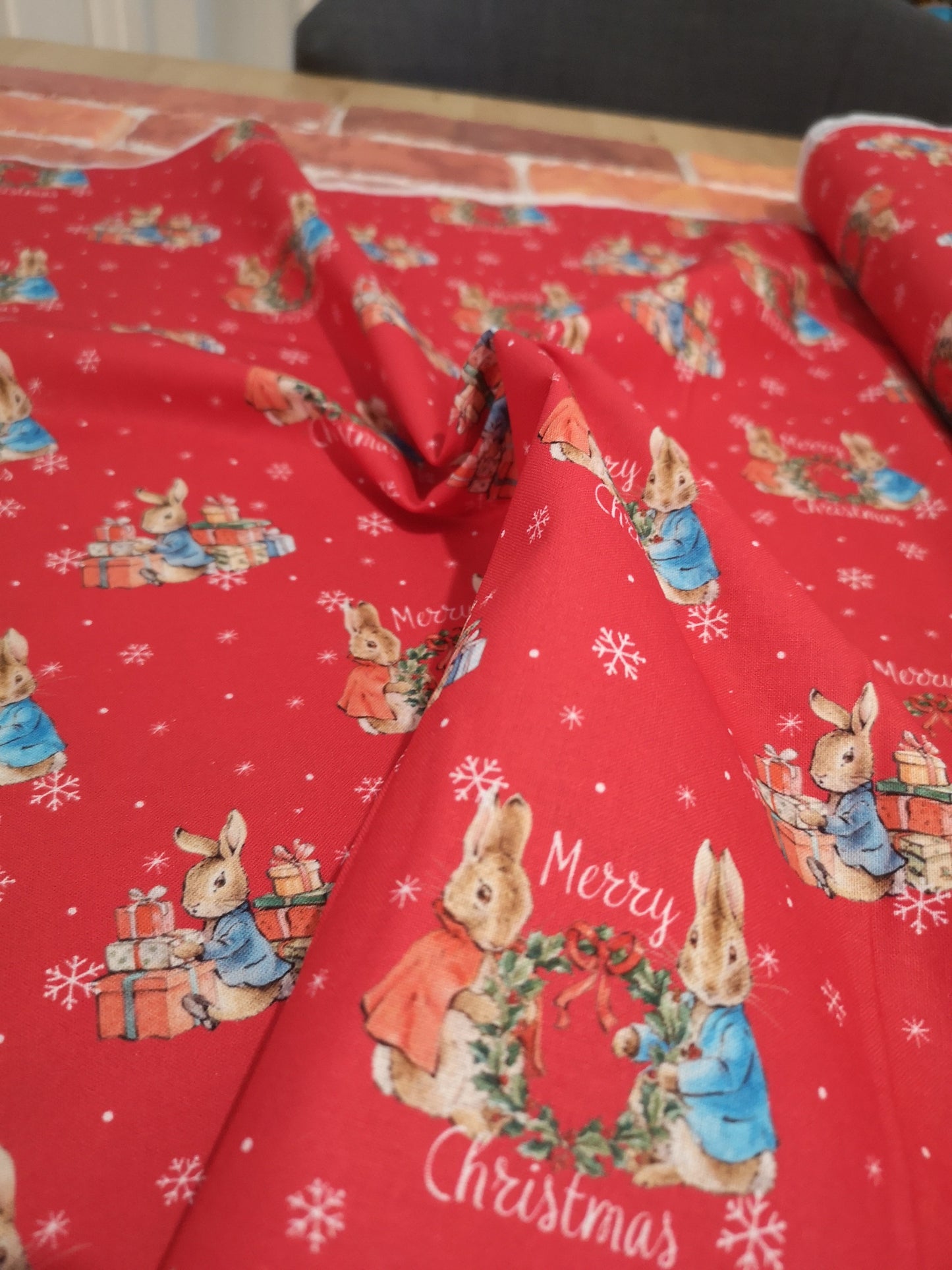 Licensed Peter Rabbit Christmas cotton: rabbits, Christmas pudding, snowman, sledge, stockings, Robins, presents, wreath, snow, tree