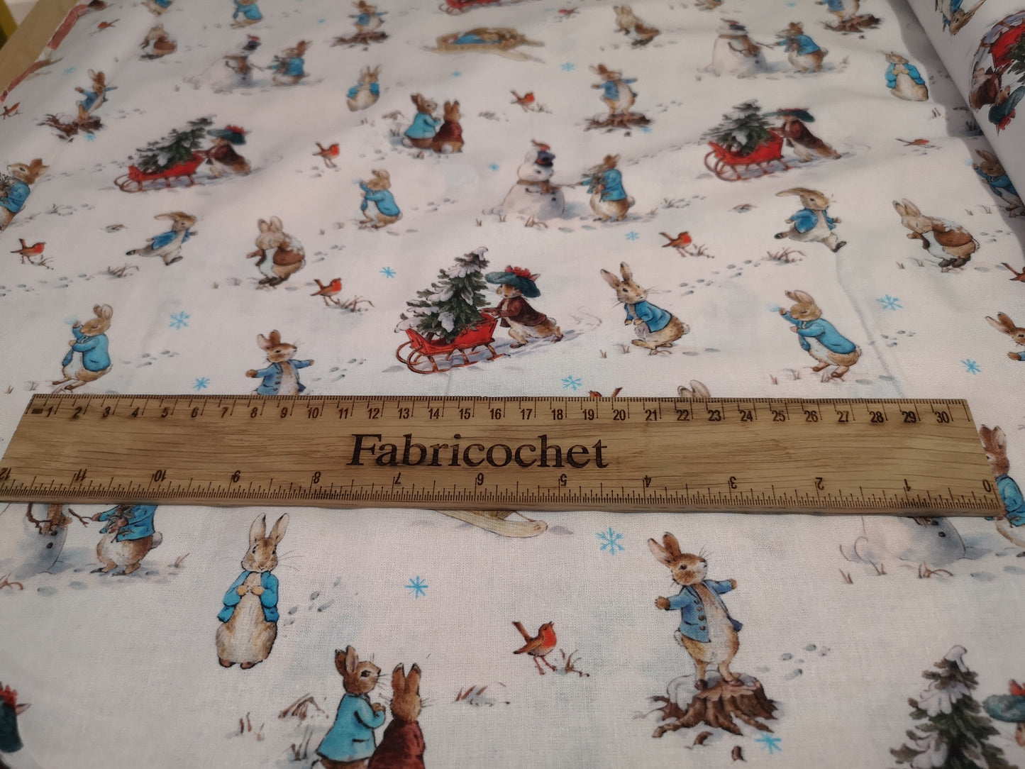 Licensed Peter Rabbit Christmas cotton: rabbits, Christmas pudding, snowman, sledge, stockings, Robins, presents, wreath, snow, tree