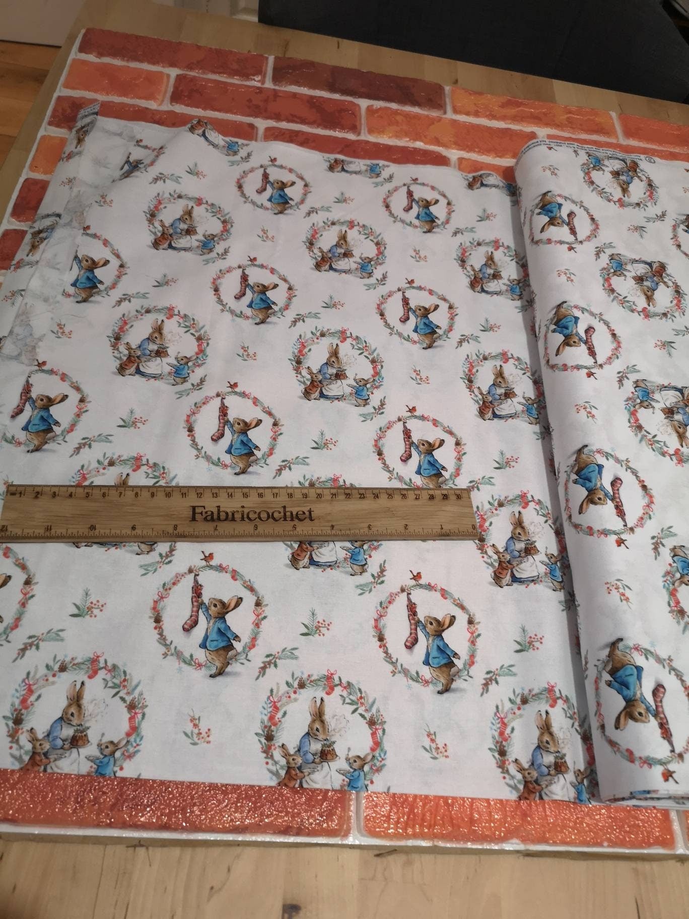 Licensed Peter Rabbit Christmas cotton: rabbits, Christmas pudding, snowman, sledge, stockings, Robins, presents, wreath, snow, tree