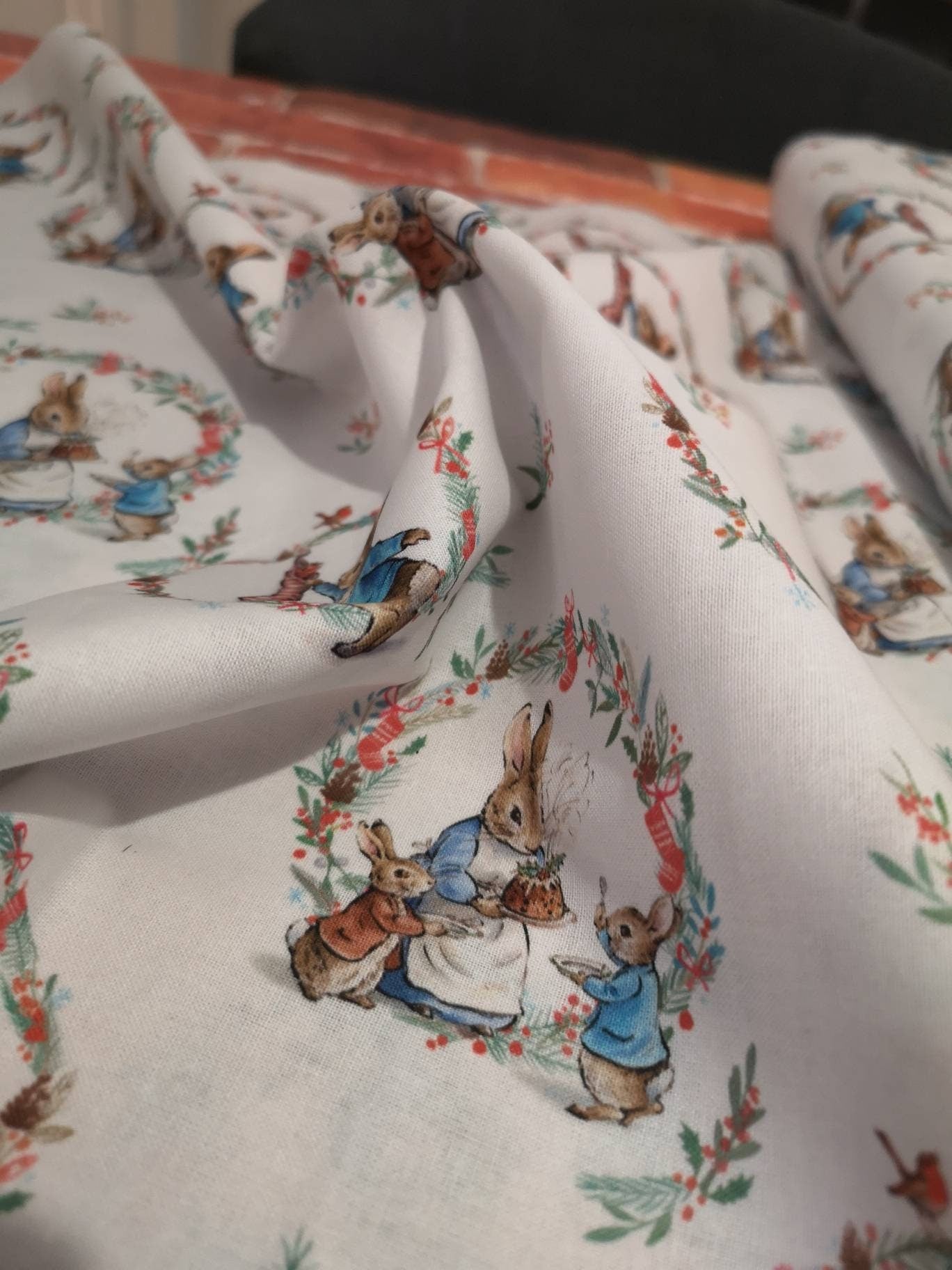 Licensed Peter Rabbit Christmas cotton: rabbits, Christmas pudding, snowman, sledge, stockings, Robins, presents, wreath, snow, tree